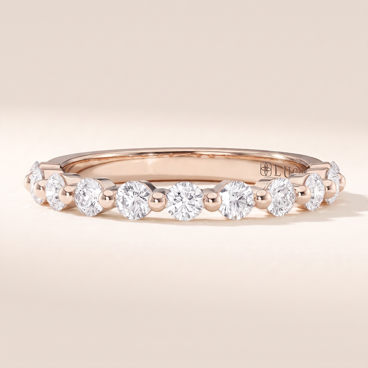 Chiesa Floating Shared Prong Diamond Band – rose gold